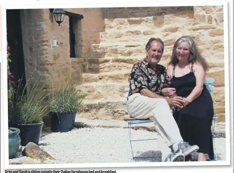  ??  ?? Greg and Sandra sitting outside their Italian farmhouse bed and breakfast.