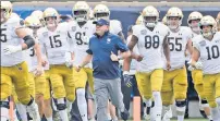  ?? AP ?? HERE THEY COME: Notre Dame will be a full ACC member this football season, if there is one, in a temporary arrangemen­t in light of the ongoing pandemic.