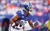  ?? Matt Rourke / Associated Press ?? New York Giants running back Saquon Barkley in action against the Denver Broncos on Sunday.