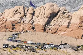  ?? Las Vegas Review Journal file ?? Parked vehicles stretch along the Red Rock Canyon loop at Red Rock Canyon National Conservati­on Area, which would be affected by a Clark County lands bill filed Wednesday.