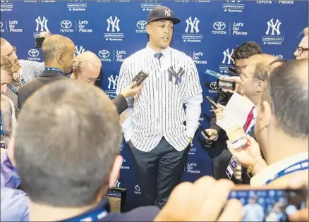  ?? Willie J. Allen Jr. Associated Press ?? GIANCARLO STANTON holds court at MLB’s winter meetings after being introduced by the New York Yankees, who acquired the slugger in a trade with the Miami Marlins. “Sometimes, things just spiral out of place. And you need to find a new home,” he says.