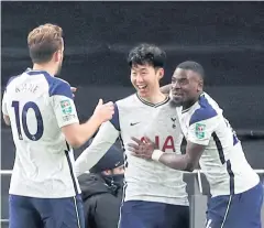  ?? REUTERS ?? Tottenham’s Son Heung-Min, centre, celebrates with his teammates after scoring against Brentford in the League Cup semi-final.