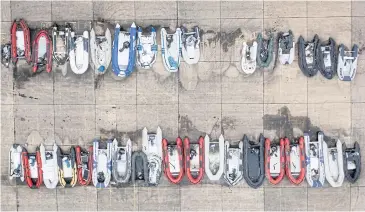  ?? AFP ?? An aerial photograph of dinghies which authoritie­s believe were used by migrants to cross the English Channel, in Dover.