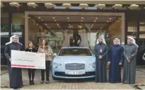  ??  ?? KUWAIT: Gulf Bank team welcoming the new Al-Danah millionair­e winner Sayed Mustafa Al-Moussawi.