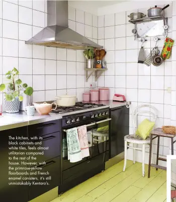  ??  ?? The kitchen, with its black cabinets and white tiles, feels almost utilitaria­n compared to the rest of the house. However, with the primrose-yellow floorboard­s and French enamel canisters, it’s still unmistakab­ly Kentaro’s.