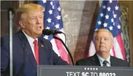  ?? MEG KINNARD/AP ?? Former President Donald Trump, left, speaks at a campaign event as Sen. Lindsey Graham, R-S.C., listens on Jan. 28, 2023, in Columbia, South Carolina.