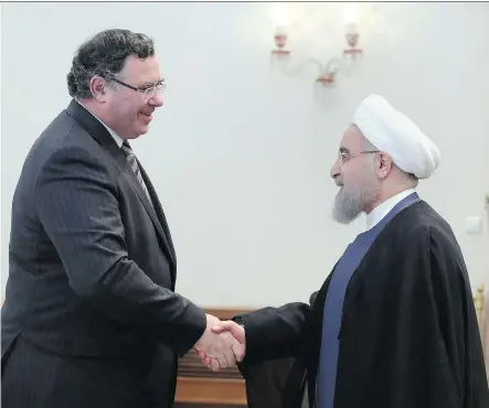  ?? IRANIAN PRESIDENCY OFFICE VIA AP ?? Iranian President Hassan Rouhani, right, welcomes Total CEO Patrick Pouyanne to their meeting in Tehran on Monday. Pouyanne says Iran and Total’s agreement to develop the South Pars offshore gas field heralds the “first of many” projects for Total in...