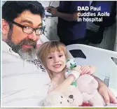  ??  ?? DAD Paul cuddles Aoife in hospital