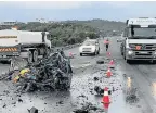  ??  ?? NOTHING LEFT: The mangled wreck of a car on the R72 near Port Alfred