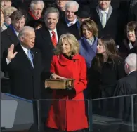  ?? (AP/Elise Amendola) ?? This 2009 file photo shows Vice President-elect Joe Biden taking the oath of office from Justice John Paul Stevens as his wife, Jill Biden, holds the Bible at the U.S. Capitol in Washington.