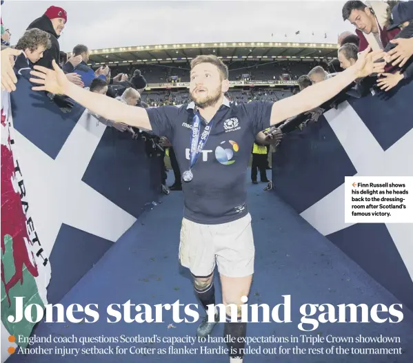  ??  ?? 2 Finn Russell shows his delight as he heads back to the dressingro­om after Scotland’s famous victory.