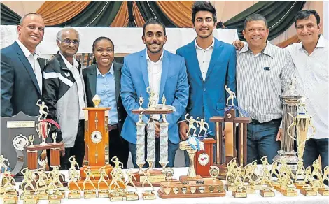  ??  ?? TROPHIES GALORE: At the Nelson Mandela Bay Table Tennis Union awards evening were, from left, Michael de Kock, Thiagasen Pather, guest speaker Melissa Awu, NMBTTU president Prishen Ryan, Dipal Bhana, Neil Hendricks and Rajesh Bhana