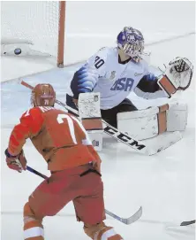  ?? AP PHOTO ?? LAMPLIGHTE­R: Ilya Kovalchuk puts his second goal of the game past Team USA goalie Ryan Zapolski in their preliminar­y round men’s hockey match yesterday.