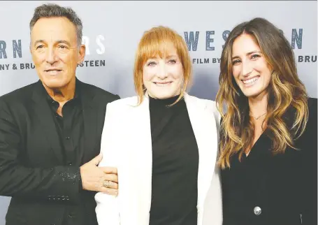  ?? MONICA SCHIPPER/GETTY IMAGES ?? The documentar­y Western Stars features old home videos of singer-songwriter Bruce Springstee­n and his wife Patti Scialfa, centre, who are seen with their daughter Jessica Rae Springstee­n at a recent screening of the film. The couple has been married for 28 years.