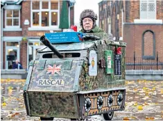  ??  ?? Eddie Wadsworth sells poppies from his mobility scooter; 1940 Cruiser Mk IV tank, inset