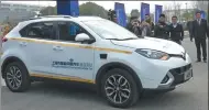  ?? GAO ERQIANG / CHINA DAILY ?? An intelligen­t connected vehicle takes part in road tests on Thursday in Shanghai.