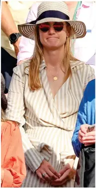  ?? ?? Courtside cool: Norrie’s girlfriend Louise Jacobi sports a cut-out striped dress in the stands