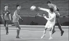  ?? MIKE BUSH/ NEWS-SENTINEL ?? Battling for the ball in Tuesday's nonleague boys soccer game at the Grape Bowl are Tokay's Jordan Baumback and Liberty Ranch's Salvador Medrano (14), David Rangel (8) and watching is Mason Ginni (2).