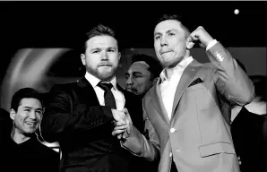  ?? KEVORK DJANSEZIAN / GETTY IMAGES / AFP ?? Canelo Alvarez (left) and champion Gennady Golovkin pose during Tuesday’s media conference in Los Angeles to announce their May 5 middleweig­ht title rematch at T-Mobile Arena in Las Vegas.