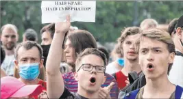  ?? Igor Volkov The Associated Press ?? A man holds a poster reading “Our region, our governor!” at a protest Monday in Khabarovsk, Russia, to support imprisoned regional governor Sergei Furgal.