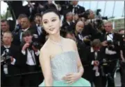  ?? PHOTO BY JOEL C RYAN — INVISION — AP, FILE ?? Chinese actress Fan Bingbing poses for photograph­ers upon arrival at the opening ceremony of the 71st internatio­nal film festival, Cannes, southern France. One of China’s highest paid celebritie­s, Fan disappeare­d from public view for four months before appearing to apologize for tax-evasion.