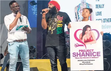 ??  ?? Ity (left) and Anthony Cruz are joined by a youngster onstage holding a poster of Shanice as they try to raise awareness about domestic violence.