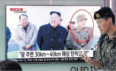  ?? Jeon Heon-kyun European Pressphoto Agency ?? NORTH KOREAN leader Kim Jong Un, center, seen in a news broadcast in Seoul, has threatened a missile strike on Guam.