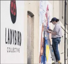  ??  ?? ■ Work underway on The We Can Do mural in Fennel Street, Loughborou­gh, which is the latest in the town’s Ladybird Collective street art initiative.