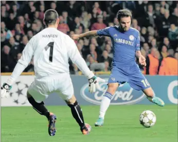  ??  ?? Chelsea’s Juan Mata fires the ball past Jesper Hansen of FC Nordsjaell­and to score in Copenhagen last night.