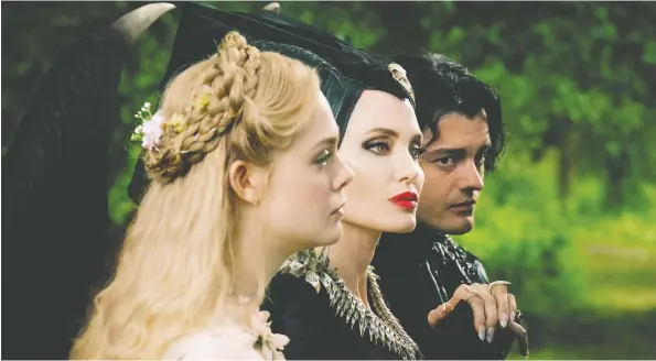  ?? DISNEY ?? Forget damsels in distress. Maleficent: Mistress of Evil, starring actors Elle Fanning, left, Angelina Jolie and Sam Riley, is a strong female-centric story with a dark side.