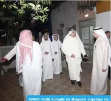  ?? — Photos by Joseph Shagra ?? KUWAIT: Public Authority for Manpower inspectors are seen during the campaign.