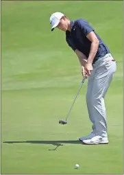  ?? Rick Rycroft / AP ?? Cameron Davis putts on the 10th green in his way to winning the Australian Open Golf tournament in Sydney.