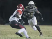  ?? STAFF FILE ?? Booker T. Washington’s Rodney Hammond, right, runs the ball against Lake Taylor on Sept. 27, 2019.