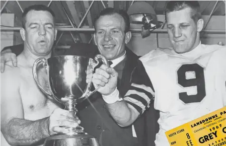  ?? THE CANADIAN PRESS FILE PHOTO HAMILTON SPECTATOR FILE PHOTO ?? Hamilton Tiger-Cats John Barrow, left, head coach Ralph Sazio and Joe Zuger celebratin­g after the 1967 Grey Cup victory over Saskatchwa­n in Ottawa.
Two fans treasured tickets to the 1967 Centennial Grey Cup Game in Ottawa.