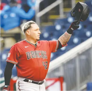  ?? GREG FIUME/GETTY IMAGES ?? Asdrubal Cabrera of the Arizona Diamondbac­ks tips his hat to appreciati­ve fans at Nationals Park in Washington, D.C. before batting in the first inning on Thursday night. Cabrera is one of many players who didn't get their official post-world Series ovation with the Nationals.