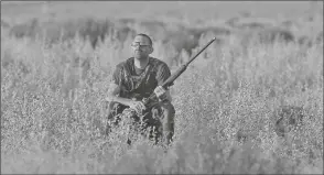  ?? HOTOS BY RANDY HOEFT/ YUMA SUN ?? Buy these photos at YumaSun.com P ABOVE: A hunter sits in a field in the area of County 18th Street and Avenue 1E waiting for doves to fly overhead Tuesday morning.