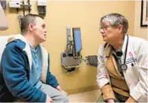  ?? TONY LEYS/KFF HEALTH NEWS ?? Nurse practition­er Moya Peterson speaks to patient Christophe­r Yeo at her clinic.