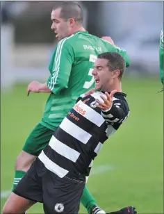  ??  ?? PENO: Aaron Comerford, Quay is brought down in the penalty area by James Guilfoyle.