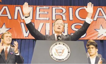  ?? AP FILE PHOTO ?? President-elect George H.W. Bush acknowledg­es the crowd’s applause during a victory rally Nov. 9, 1988, after becoming the first sitting vice president to be elected president since 1836.