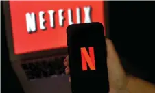  ?? — AFP photo ?? Netflix reported a jump in paid subscripti­ons as strict confinemen­t rules keep millions of people at home in a bid to curtail the coronaviru­s outbreak, effectivel­y providing an enormous captive audience to the entertainm­ent giant.