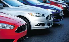  ?? KEITH SRAKOCIC / THE ASSOCIATED PRESS FILES ?? A row of new Ford Fusions on sale at a dealership. Ford is looking at ending production of most of its U.S. car models, including the Fusion, Taurus and Fiesta.