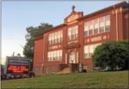  ?? DIGITAL FIRST MEDIA FILE PHOTO ?? The cornerston­e of the St. Aloysius Parish School building on North Hanover Street was laid in 1913.