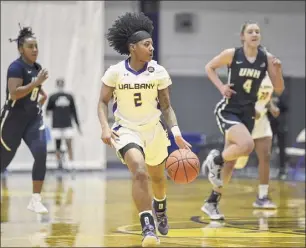  ?? Kathleen Helman / Ualbany athletics ?? Ualbany point guard Kyara Frames brings the ball upcourt on Sunday against New Hampshire. Frames played all 40 minutes and finished with 11 points.