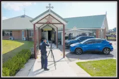  ?? ?? A police forensic officer at the Christ the Good Sheperd church.