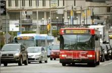  ?? Lake Fong/Post-Gazette ?? A Port Authority bus travels along Forbes Avenue in Oakland. An Allegheny County Common Pleas judge said he will decide soon whether Port Authority employees must comply with a COVID-19 vaccine mandate by mid-March.