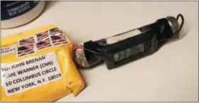  ?? ABC NEWS VIA AP ?? This image obtained Wednesday shows a package addressed to former CIA head John Brennan and an explosive device that was sent to CNN’s New York office. The mail-bomb scare widened Thursday as law enforcemen­t officials seized more suspicious packages.