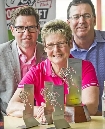  ?? Photo: Nev Madsen ?? FLASH TROPHIES: Admiring the trophies on offer at this month’s inaugural Arthur Postle Gift meeting are TRC councillor Geoff McDonald, Pittsworth Pioneer Village advisory committee chair Ros Scotney and Postle Gift working member Greg Quinn.