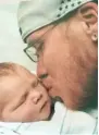  ??  ?? LEFT: Joseph “Jojo” Rosenbaum, 36, kisses his daughter. PROVIDED