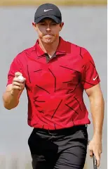  ?? EPA ?? Wearing it well: Rory McIlroy sports Tiger’s traditiona­l last-day red