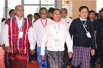  ??  ?? Myanmar President Win Myint (centre) arrives to attend the third session of the Union Peace Conference in Naypyidaw. — AFP photo
